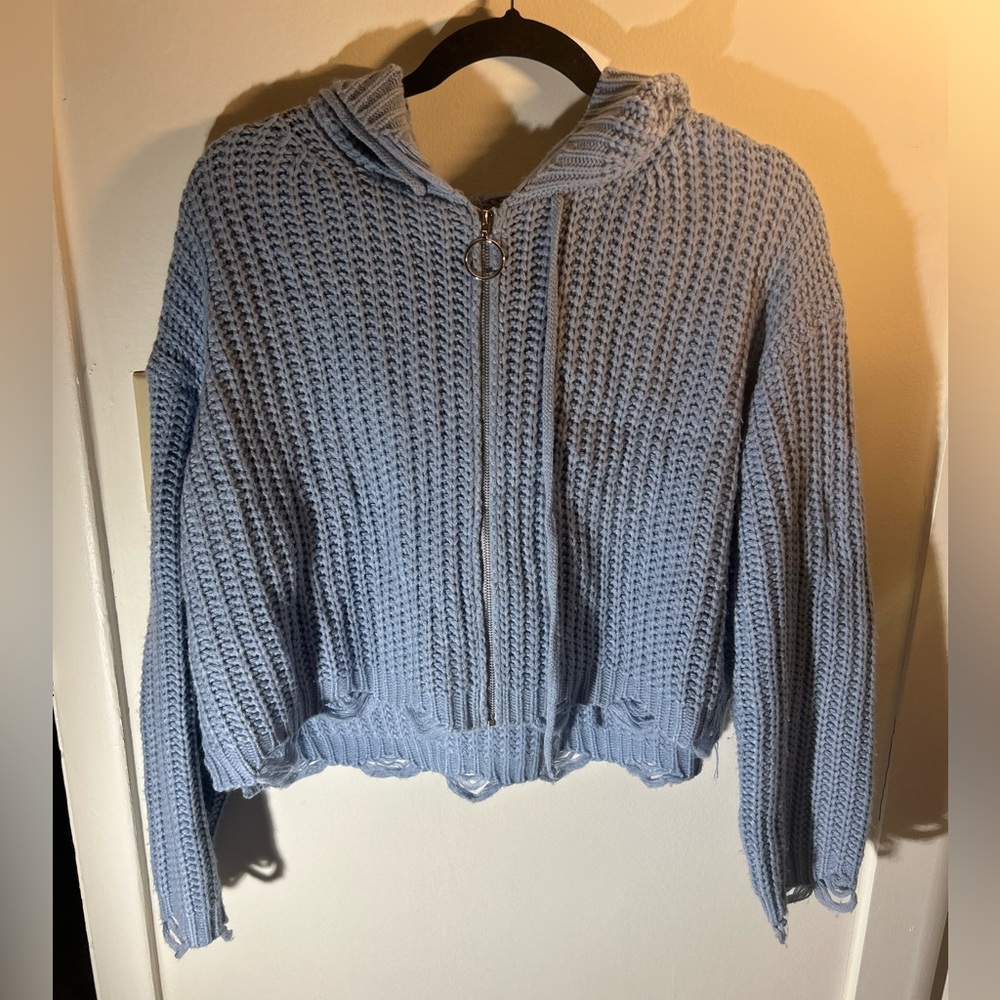 Blue knit zip up with distressing